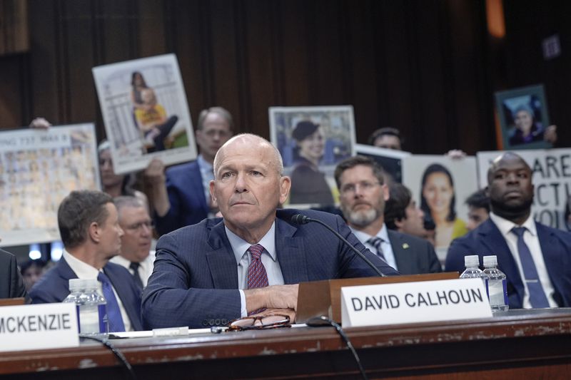 Boeing CEO Dave Calhoun, center, testifies at a Senate Homeland Security Subcommittee on Investigations hearing on Capitol Hill Tuesday, June 18, 2024, in Washington. (AP Photo/Mariam Zuhaib)