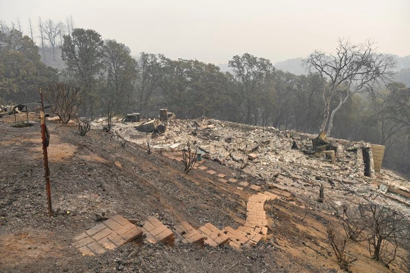 FILE - A home on Millie May Lane is destroyed by a fire in Vacaville, Calif., on Thursday, Aug. 20, 2020. Jose Carlos Fajardo/Bay Area News Group via AP, File)