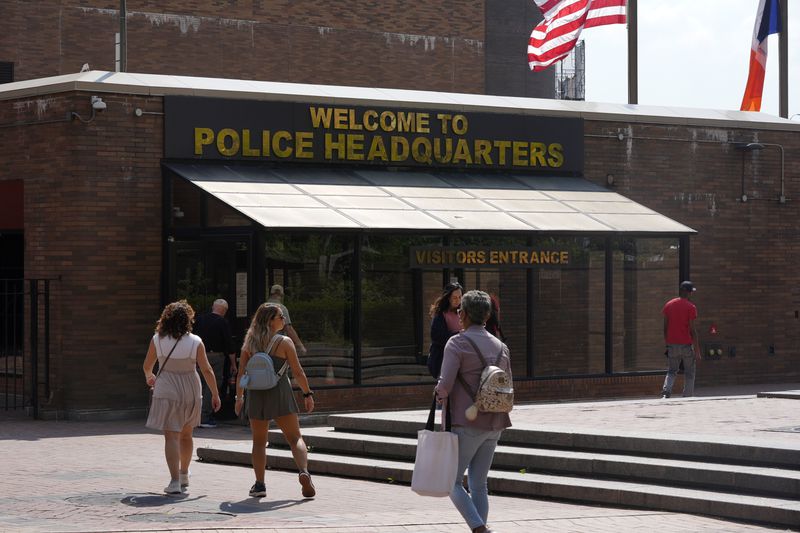 People walk past One Police Plaza, the headquarters of the New York City Police Department, Thursday, Sept. 12, 2024, in New York. (AP Photo/Pamela Smith)