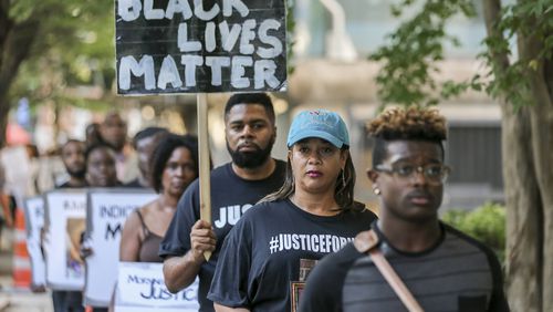 Protesters participate in a 24-hour rally outside the Fulton County Justice Center to bring attention to the number of black men killed by police on Wednesday, Aug. 31, 2016. JOHN SPINK /JSPINK@AJC.COM