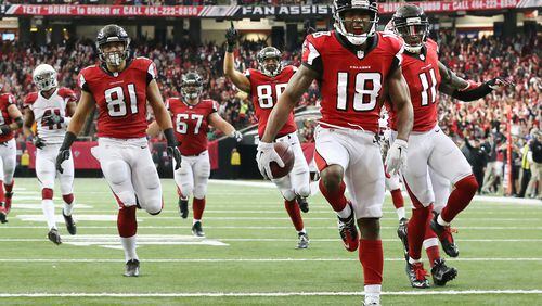 Falcons receiver Taylor Gabriel sprints gladly into the endzone against Arizona. (Curtis Compton/ccompton@ajc.com)