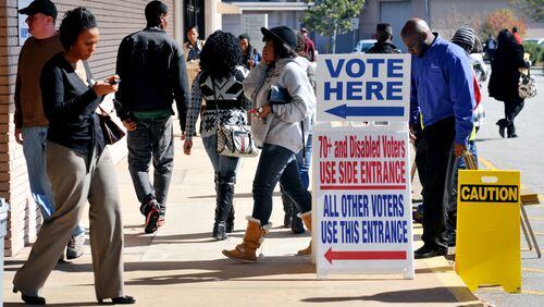 LEDE November 1, 2012 DECATUR A steady stream of early voters is seen at the Dekalb Voter Registrations and Elections offices on Memorial Drive in Decatur Thursday November 1, 2012. White voters continue to lose clout in Georgia. For the first time in state history, they make up less than 60 percent of registered voters expected to participate in this year's presidential election, according to new numbers from the Secretary of State's office. Among "active" registered voters, blacks remained steady at about 30 percent. The biggest difference, however, came from a growing pool of voters who declined to identify themselves by race or ethnicity. One caution: These numbers excluded some registered voters because of inactivity, although they remain eligible to vote in Georgia. KENT D. JOHNSON / AJC An early voting site in Decatur in 2012 (AJC/Kent Johnson)