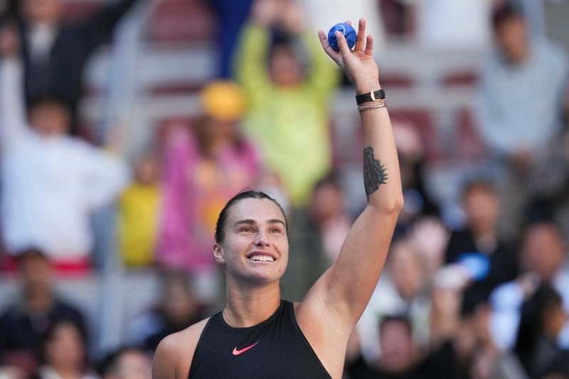 Aryna Sabalenka of Belarus gestures after winning against Madison Keys of the United States during their women's singles match of the China Open tennis tournament, at the National Tennis Center in Beijing, Wednesday, Oct. 2, 2024. (AP Photo/Achmad Ibrahim)