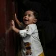 Palestinian child Ali Al-Taweel, who was born on October 7, poses for a picture at his family home in Nuseirat, as the Israeli-Hamas war marks its one year anniversary, Gaza Strip, Saturday, Oct. 5, 2024. (AP Photo/Abdel Kareem Hana)