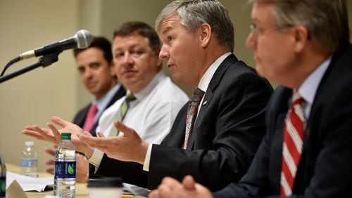 U.S. Rep. Rob Woodall, R-Ga., peaks during a roundtable discussion in 2015. BRANT SANDERLIN/BSANDERLIN@AJC.COM