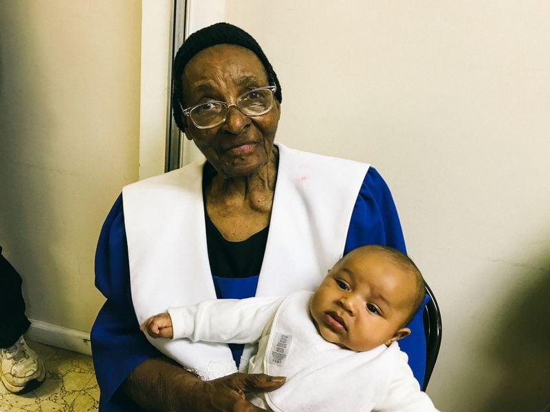 Perdue, pictured here with her great-great-grandson, Cassius Askew, will be celebrating her 100th birthday with her grandchildren, great-grandchildren and great-great-grandchildren.