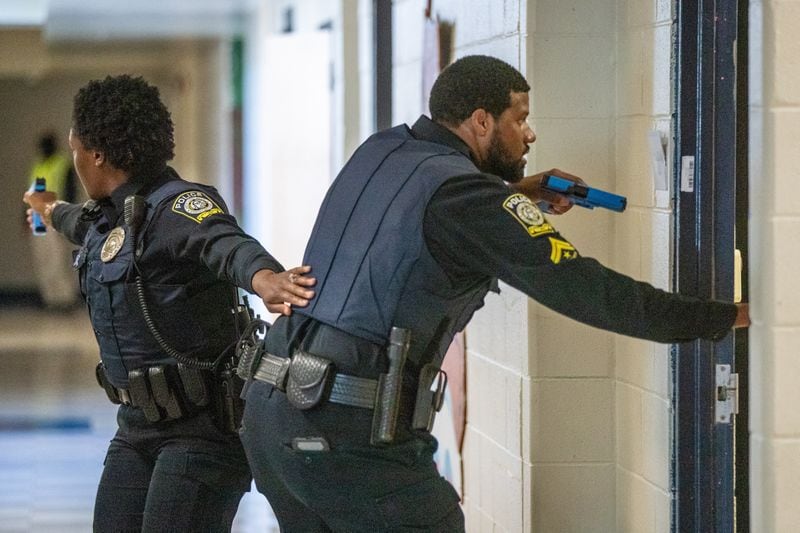 Atlanta Public Schools police officers participate in an active shooter training drill at the former Towns Elementary School in Atlanta on Thursday, July 28, 2022. (Steve Schaefer / steve.schaefer@ajc.com)