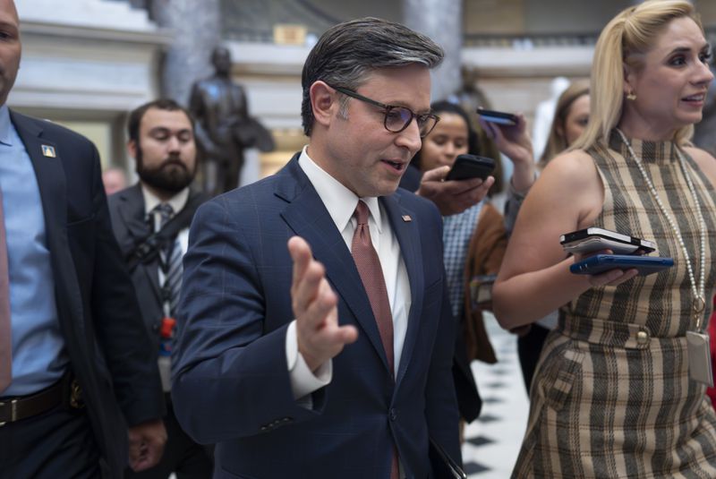 Speaker of the House Mike Johnson, R-La., is followed by reporters as he walks to the House Chamber for a vote on an interim spending bill to avoid a government shutdown next week, at the Capitol in Washington, Wednesday, Sept. 25, 2024. (AP Photo/J. Scott Applewhite)