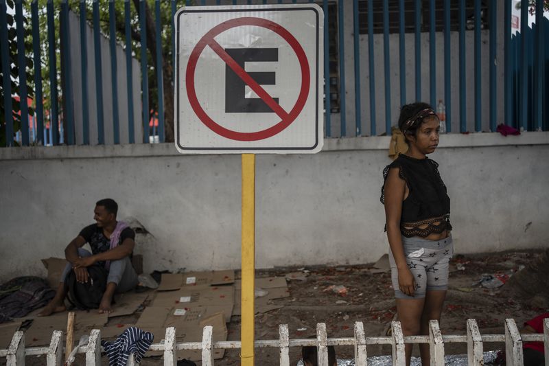 Venezuelan migrant Keilly Bolaños stands outside the bus terminal where she is living with her children and other migrants in Villahermosa, Mexico, Saturday, June 8, 2024. The single mother and her four children have been returned back to southern Mexico six times. (AP Photo/Felix Marquez)