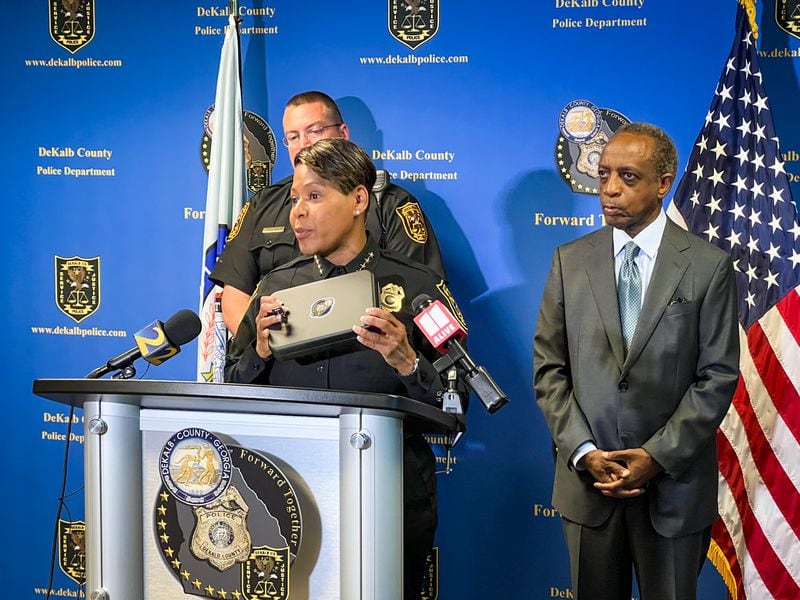 DeKalb police Chief Mirtha Ramos holds a car safe for a handgun, one of several hundred the department plans to hand out for free. 