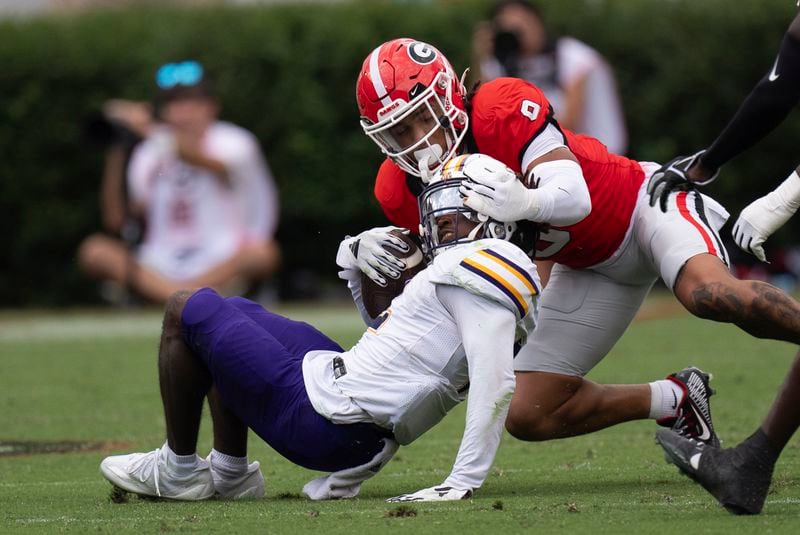 Georgia defensive back Justyn Rhett (9) is called for a face mask penalty as he tackles Tennessee Tech wide receiver Tremel Jones (2) during the second half of an NCAA college football game Saturday, Sept. 7, 2024, in Athens, Ga. (AP Photo/John Bazemore)