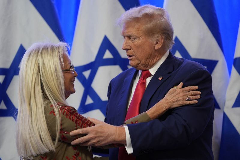 Republican presidential nominee former President Donald Trump greets Miriam Adelson during an event on combating antisemitism at Trump National Golf Club, Thursday, Aug. 15, 2024, in Bedminster, N.J. (AP Photo/Julia Nikhinson)