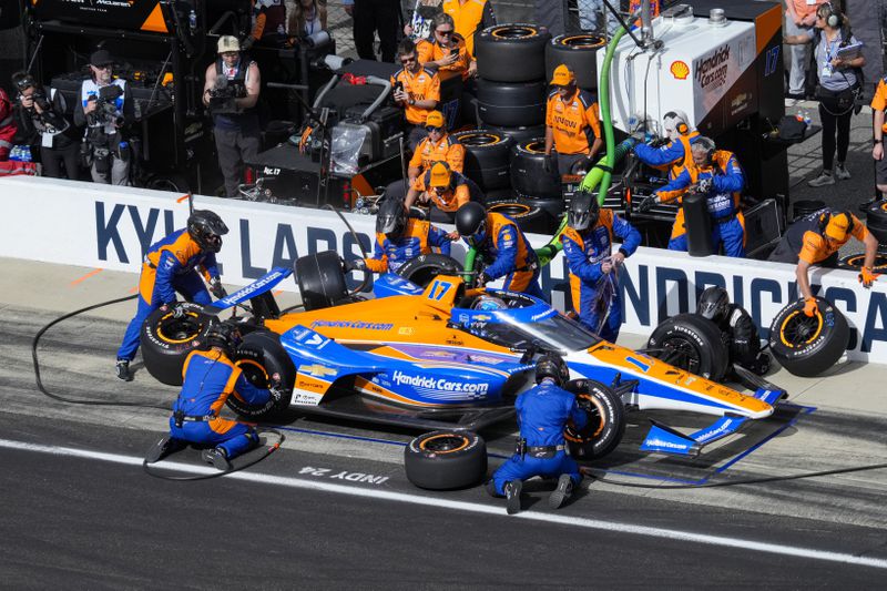 Kyle Larson pits during the Indianapolis 500 auto race at Indianapolis Motor Speedway in Indianapolis, Sunday, May 26, 2024. (AP Photo/AJ Mast)
