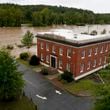 The banks of the Swannanoa river overflow an effect of Hurricane Helene, Friday, Sept. 27, 2024, in Asheville, N.C. (AP Photo/Erik Verduzco)