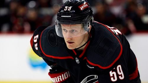 FILE - Carolina Hurricanes' Jake Guentzel (59) watches the puck during the second period of an NHL hockey game against the Boston Bruins in Raleigh, N.C., April 4, 2024. The Tampa Bay Lightning got a head start on free agency by acquiring the rights to high-scoring winger Guentzel. The Lightning sent a 2025 third-round draft pick to Carolina on Sunday, June 30. (AP Photo/Karl B DeBlaker, File)