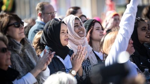 Sumbul Siddiqui, center, a recipient of protection from deportation under the Deferred Action for Childhood Arrivals program, smiles during a Power to the Polls event in January in Atlanta. BRANDEN CAMP/SPECIAL