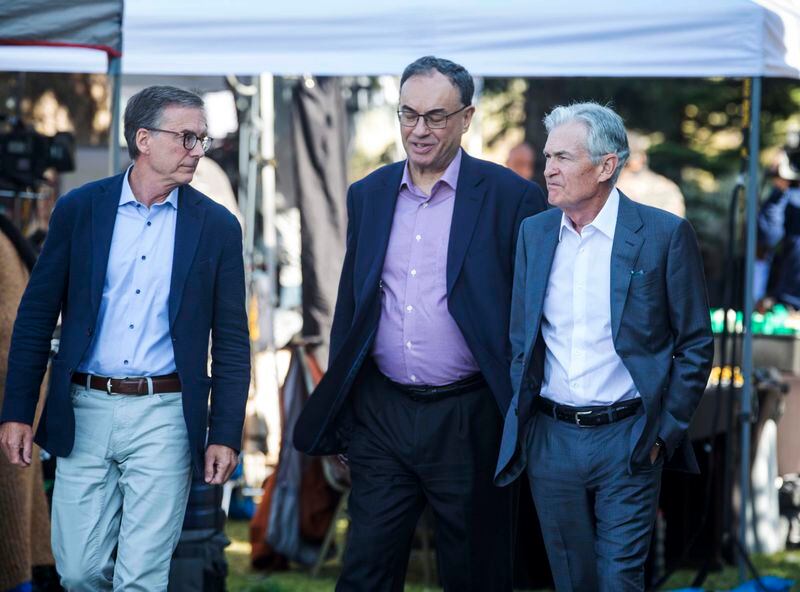 Governor of the Bank of Canada Tiff Macklem, left, and Governor of the Bank of England Andrew Bailey, center, walk with Federal Reserve Chairman Jerome Powell at the Jackson Hole Economic Symposium at Jackson Lake Lodge in Grand Teton National Park near Moran, WY on Friday, Aug. 23, 2024. (AP Photo/Amber Baesler)