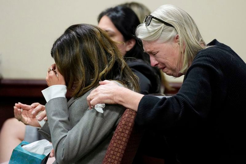 Hilaria Baldwin, left, wife of actor Alec Baldwin, and his sister Elizabeth Keuchler react during Alec Baldwin's trial for involuntary manslaughter for the 2021 fatal shooting of cinematographer Halyna Hutchins during filming of the Western movie "Rust," Friday, July 12, 2024, at Santa Fe County District Court in Santa Fe, N.M. The judge threw out the case against Alec Baldwin in the middle of his trial and said it cannot be filed again. (Ramsay de Give/Pool Photo via AP)