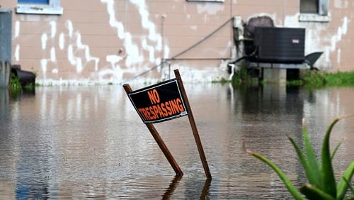 A home in Rubonia, Fla., is surrounded by floodwater after Tropical Storm Debby swept through the area, Monday, Aug. 5, 2024, in Bradenton, Fla. (Tiffany Tompkins/The Bradenton Herald via AP)
