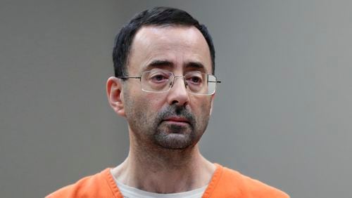 FILE - Disgraced former sports doctor Larry Nassar appears in court for a plea hearing, Nov. 22, 2017, in Lansing, Mich. (AP Photo/Paul Sancya, File)