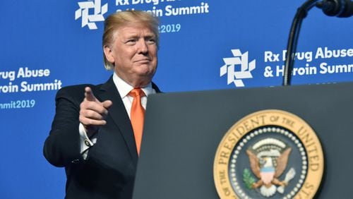 President Donald Trump reacts after he was introduced during his last visit to Atlanta in April for an opioid summit. HYOSUB SHIN / HSHIN@AJC.COM