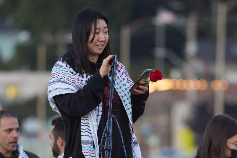 Sue Han, a friend of the 26-year old Aysenur Ezgi Eygi, killed recently in the occupied West Bank, during vigil on Alki Beach, Wednesday, Sept. 11, 2024, in Seattle. Eygi grew up in Seattle, attended Seattle Public Schools and graduated from the University of Washington. (AP Photo/John Froschauer)