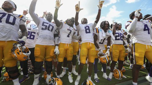 LSU celebrates a come from behind win after an NCAA college football game against South Carolina, Saturday, Sept. 14, 2024 in Columbia, S.C. LSU won 36-33. (AP Photo/Artie Walker Jr.)