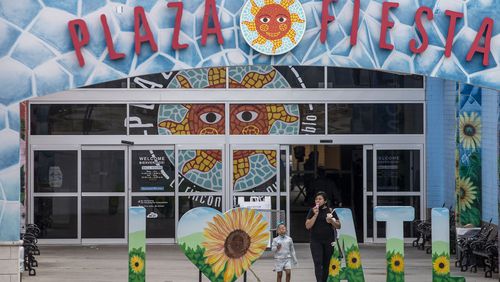 03/23/2021 —Atlanta, Georgia — Shoppers exit Plaza Fiesta in Chamblee, Tuesday, March 23, 2021. (Alyssa Pointer / Alyssa.Pointer@ajc.com)