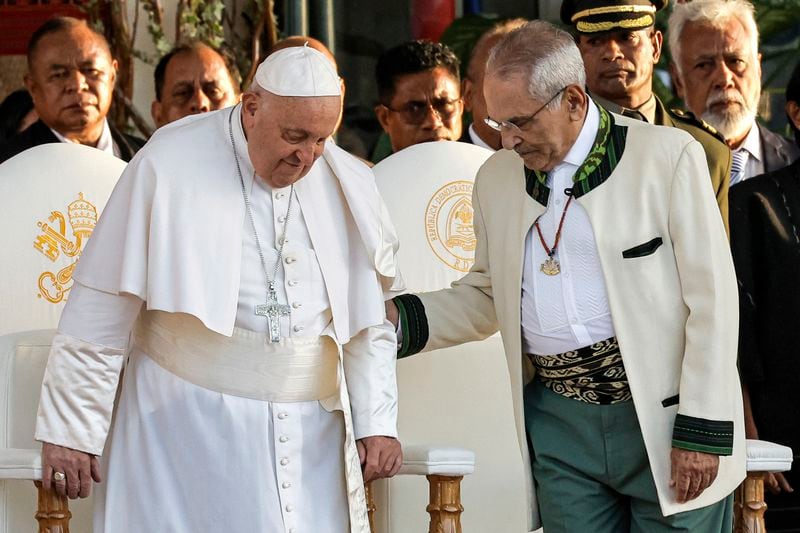 Pope Francis and East Timor's President Jose Ramos-Horta, right, arrive for a welcoming ceremony at the Presidential Palace in Dili, East Timor, Monday Sept. 9, 2024. (Yasuyoshi Chiba/Pool Photo via AP)