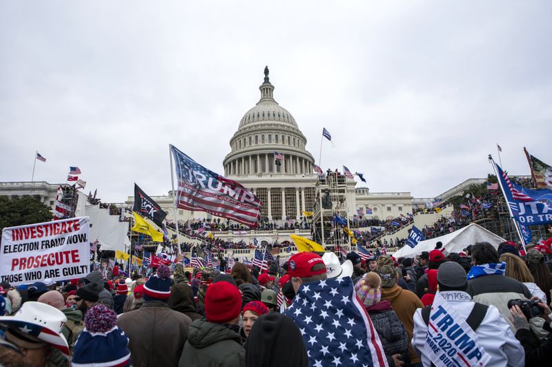 FILE - Rioters loyal to President Donald Trump rally at the U.S. Capitol in Washington, Jan. 6, 2021. (AP Photo/Jose Luis Magana, File)