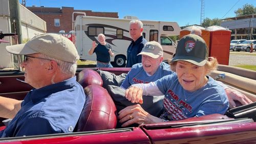 Former President Jimmy Carter and former First Lady Rosalynn Carter make their way through Plains for the annual Peanut Festival. (Photo: Jill Stuckey)