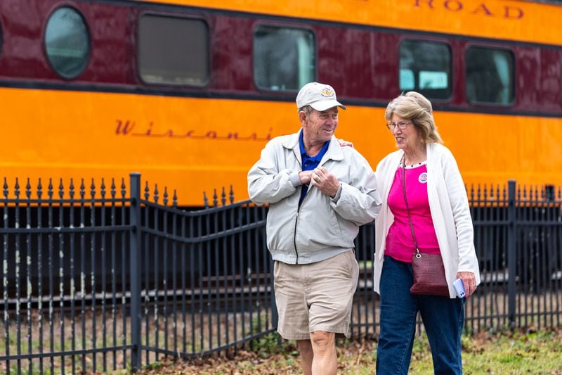 Jimmy and Mary Thompson of Fitzgerald depart the SAM Shortline excursion train in downtown Plains for a short visit on Saturday, February 25, 2023. (Arvin Temkar / arvin.temkar@ajc.com)