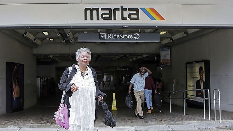 Charnette Trimble walks to her office space from MARTA's Five Points stop. She is a community activist from southwest Atlanta who is advocating for the proposed Campbellton Road light rail line.