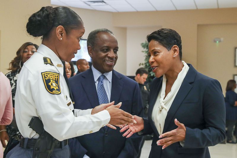 New DeKalb County police Chief Mirtha Ramos speaks with county CEO Michael Thurmond and members of the police department Monday morning. (Alyssa Pointer/Atlanta Journal Constitution)