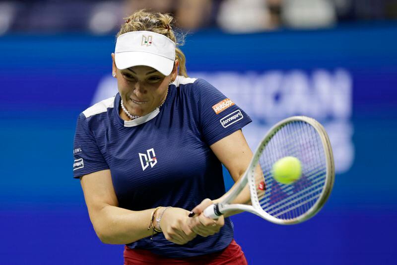 Donna Veki, of Croatia returns a shot to Zheng Qinwen, of China, during the fourth round of the U.S. Open tennis tournament Monday, Sept. 2, 2024, in New York. (AP Photo/Adam Hunger)