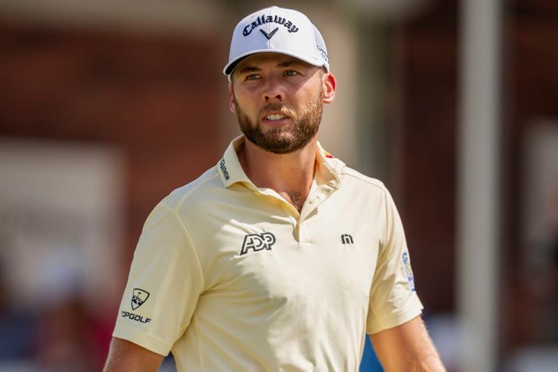 Sam Burns walks off of the green at the fourth hole after making his putt during the third round of the Tour Championship golf tournament, Saturday, Aug. 31, 2024, in Atlanta. (AP Photo/Jason Allen)