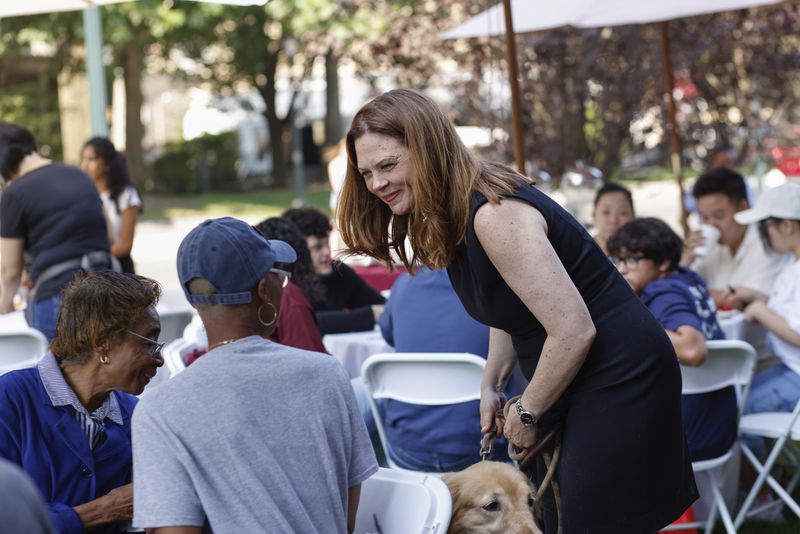 Tania Tetlow, president of Fordham University, meets families from New students during Move In Day at the Bronx campus, Sunday. Aug. 25, 2024, in New York. (AP Photo/Kena Betancur)