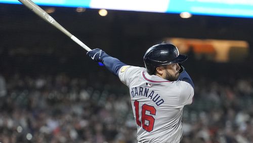 Atlanta Braves' Travis d'Arnaud watches his RBI single during the 10th inning of a baseball game against the San Francisco Giants in San Francisco, Tuesday, Aug. 13, 2024. (AP Photo/Jeff Chiu)