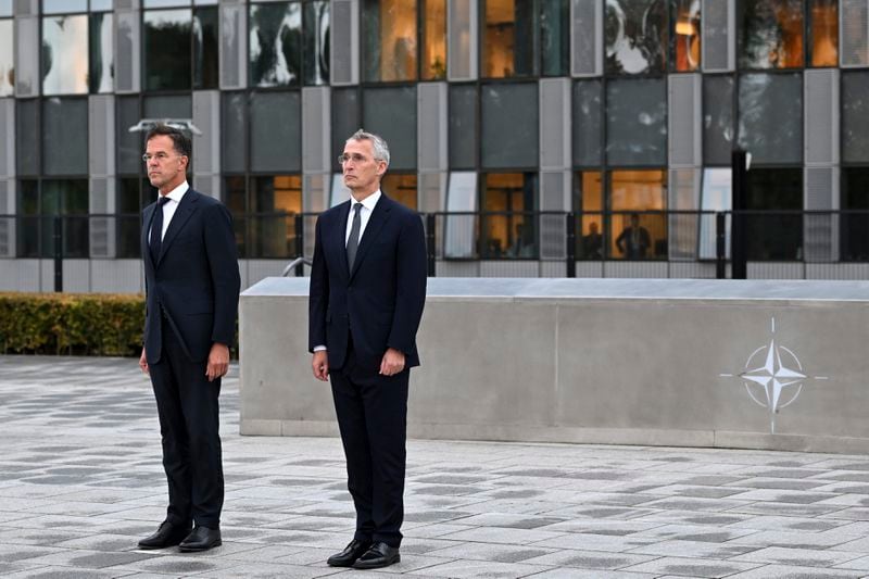 NATO Secretary General Jens Stoltenberg, right, and the incoming NATO Secretary General Mark Rutte stand during a wreath laying ceremony at NATO headquarters in Brussels, Belgium, Tuesday, Oct. 1, 2024. (AP Photo/Harry Nakos)