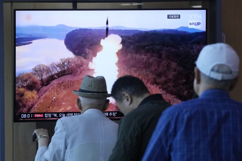 People watch a news program broadcasting a file image of a missile launch by North Korea, at Seoul Railway Station in Seoul, South Korea, Wednesday, June 26, 2024. A North Korean ballistic missile test on Wednesday likely ended in failure, South Korea's military said, days after the North protested the recent regional deployment of a U.S. aircraft carrier for a new trilateral military drill with South Korea and Japan. (AP Photo/Ahn Young-joon)