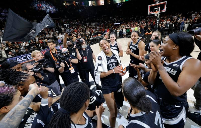 Las Vegas Aces center A'ja Wilson, center, celebrates with teammates after an WNBA basketball game against the Connecticut Sun Sunday, Sept. 15, 2024, in Las Vegas. (Steve Marcus/Las Vegas Sun via AP)