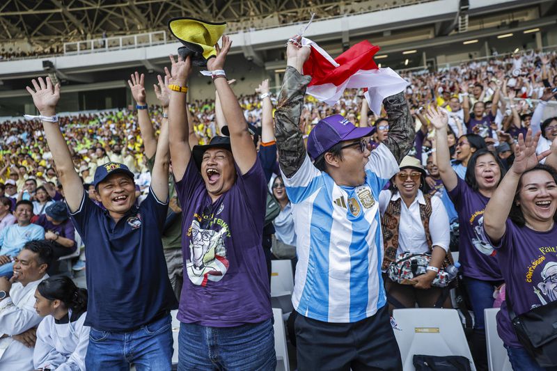 People cheer as they wait for the arrival of Pope Francis before a mass at the Gelora Bung Karno Stadium in Jakarta, Thursday, Sept. 5, 2024. (Yasuyoshi Chiba/Pool Photo via AP)