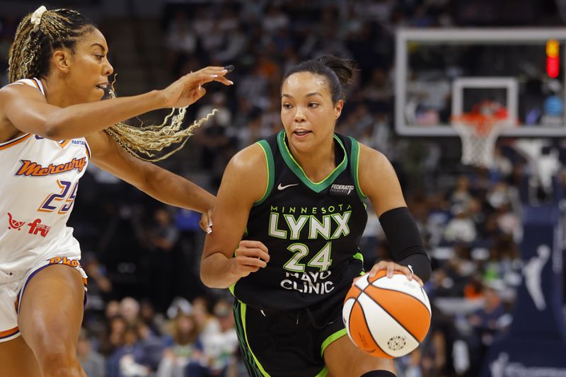 Minnesota Lynx forward Napheesa Collier (24) works around Phoenix Mercury forward Monique Billings, left, in the first quarter of Game 2 of a WNBA basketball first-round playoff game Wednesday, Sept. 25, 2024, in Minneapolis. (AP Photo/Bruce Kluckhohn)