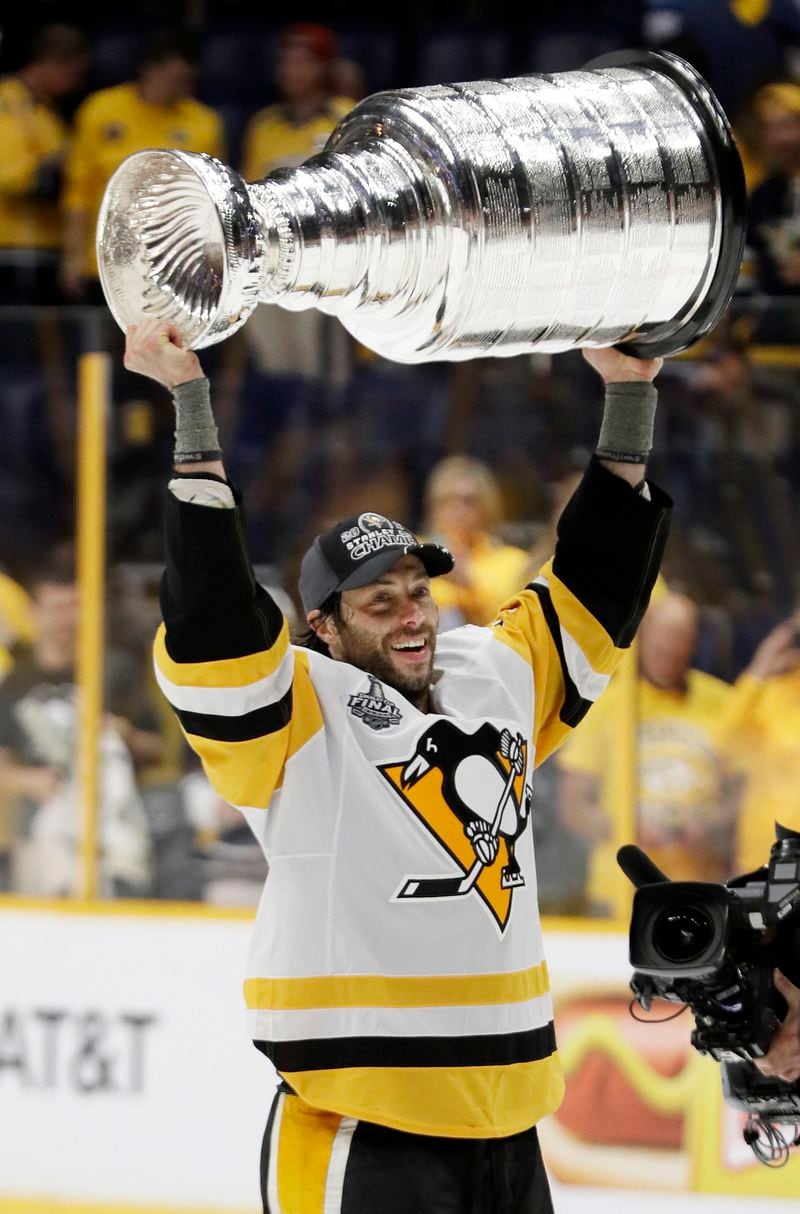 FILE - Pittsburgh Penguins center Matt Cullen celebrates with the Stanley Cup after the Penguins defeated the Nashville Predators 2-0 in Game 6 of the NHL hockey Stanley Cup Finals Sunday, June 11, 2017, in Nashville, Tenn. (AP Photo/Mark Humphrey, File)