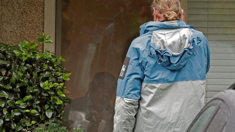 Gene Campbell, left, watches through his window as he talks on the phone with son Charlie at the Life Care Center in Kirkland, Washington. Charlie and his mother Dorothy came to visit Gene on Friday. Charlie later told reporters that his father, who had not yet been tested, was showing symptoms of the virus and would be taken to a hospital. 