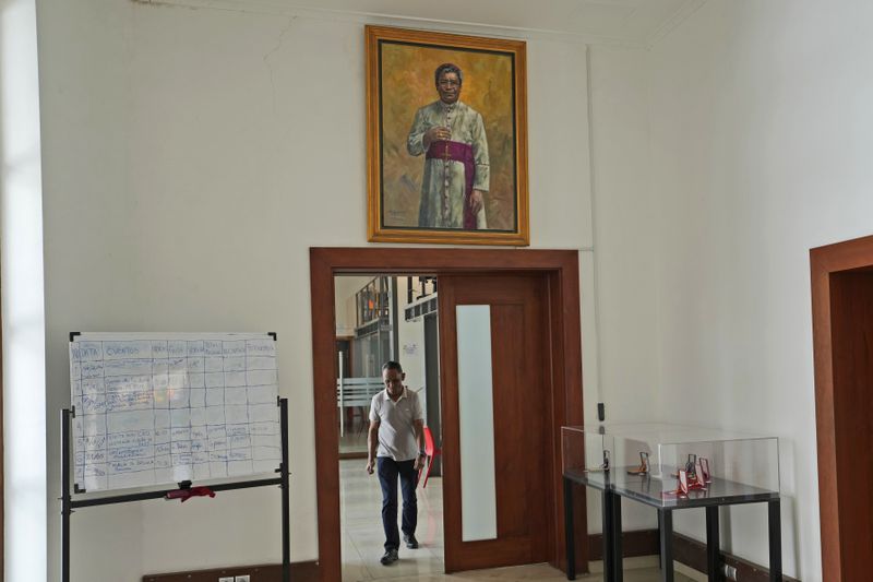 The painting of Nobel Peace Prize winner Bishop Carlos Ximenes Belo is displayed at the Timorese Resistance Museum in Dili, East Timor, Tuesday, Aug. 13, 2024. (AP Photo/Achmad Ibrahim)