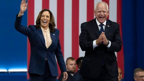 Democratic presidential nominee Vice President Kamala Harris and her running mate, Minnesota Gov. Tim Walz, arrive at a campaign rally on Aug. 6 in Philadelphia. (Joe Lamberti/AP)