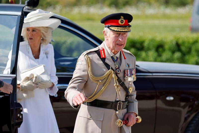 Britain's King Charles III and Britain's Queen Camilla arrive to a commemorative ceremony marking the 80th anniversary of the World War II D-Day" Allied landings in Normandy, at the World War II British Normandy Memorial of Ver-sur-Mer, Thursday, June 6, 2024. Normandy is hosting various events to officially commemorate the 80th anniversary of the D-Day landings that took place on June 6, 1944. (Ludovic Marin/Pool via AP)