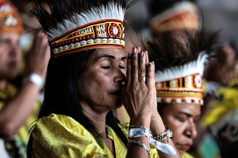 Catholic faithful attend a holy mass led by Pope Francis at the Gelora Bung Karno Stadium, in Jakarta, Thursday, Sept. 5, 2024. (Yasuyoshi Chiba/Pool Photo via AP)