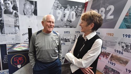 During the 50th anniversary of the Peachtree Road Race in 2019 Julia Emmons (right) celebrated with Bill Thorn. Thorn was the only individual who ran the race every one of those first 50 years. The two are seen at an unveiling of a traveling exhibit on the race. HYOSUB SHIN / HSHIN@AJC.COM